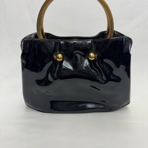 Elegant Black Handbag with Gold Accents